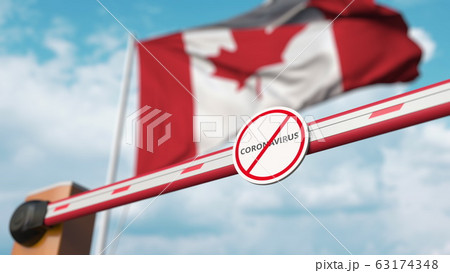 Closing boom barrier with STOP CORONAVIRUS sign against the Canadian flag. Quarantine in Canada. 3D rendering  63174348