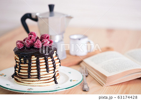 pancakes with chocolate and raspberries 63174428