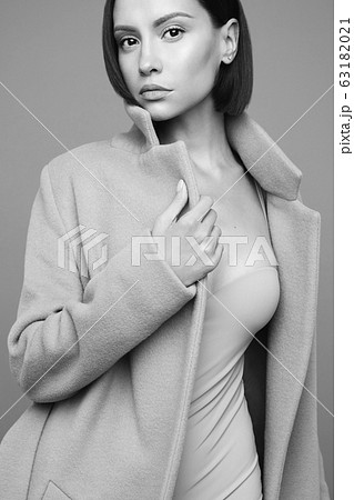 Fashion beautiful lady in beige coat Fashion beautiful lady in beige coat 63182021