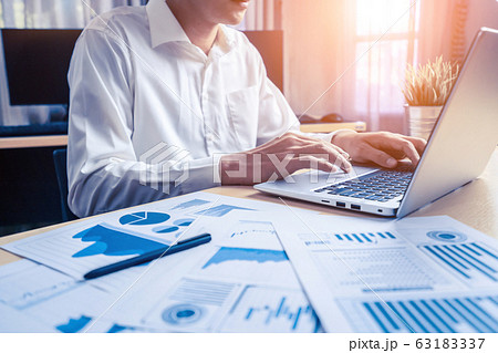 Businessman analyze data of stock market research. Businessman analyze data of stock market research. 63183337