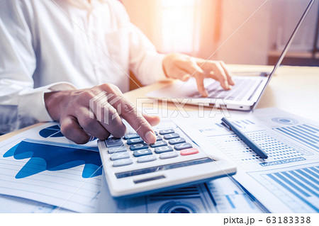 Businessman analyze data of stock market research. 63183338