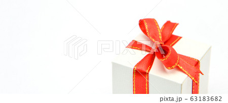 White gift box with red ribbons isolated on white White gift box with red ribbons isolated on white 63183682