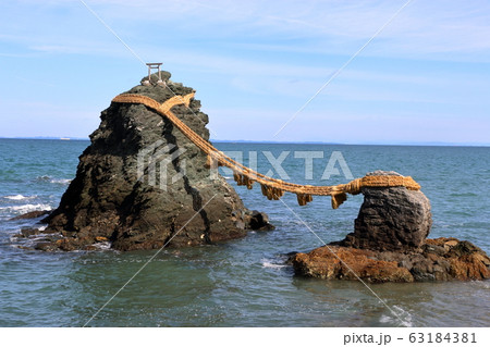 Meoto Iwa "Married Couple Rocks" of Futami, in Mie Japan, a sacred Shinto island Meoto Iwa "Married Couple Rocks" of Futami, in Mie Japan, a sacred Shinto island 63184381