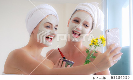 Beautiful woman having a facial treatment at spa. Beautiful woman having a facial treatment at spa. 63184539