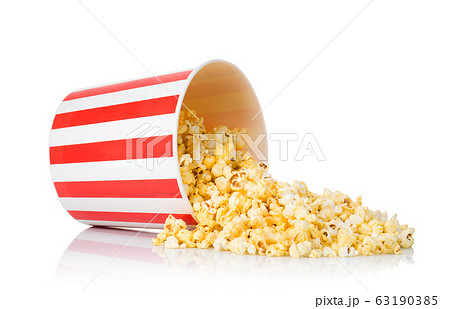 Scattered popcorn from paper striped bucket isolated on white background 63190385