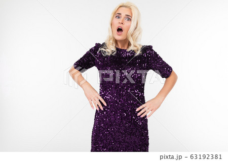 serious lady in a dress outraged on a white background with copy space 63192381