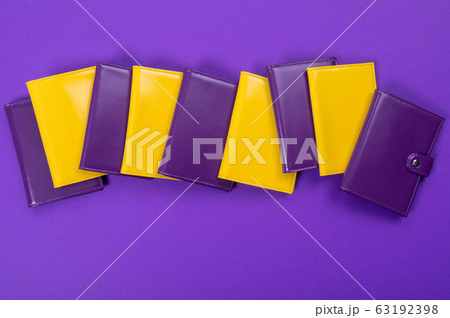 flat lay handmade purple and yellow purse on a matte table flat lay handmade purple and yellow purse on a matte table 63192398