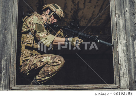 Two men in military camouflage vegetato uniforms 63192598