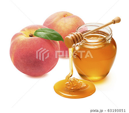 Fresh peach and honey jar with wooden dip isolated on white background 63193051