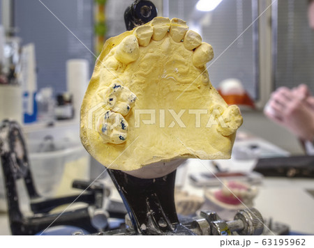 Dental gypsum articulator on the working table 63195962