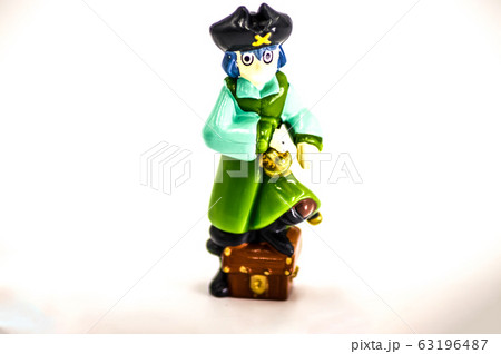 Pirate with the foot placed on a chest 63196487