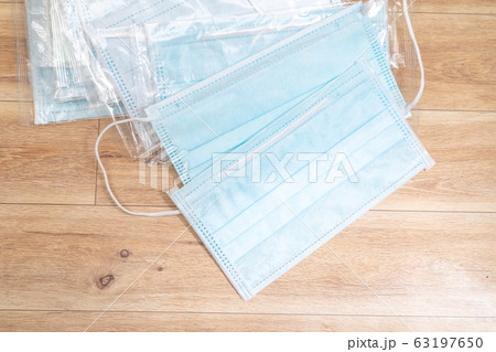 Surgical mask with rubber ear straps. Typical Surgical mask with rubber ear straps. Typical 63197650