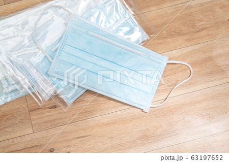 Surgical mask with rubber ear straps. Typical Surgical mask with rubber ear straps. Typical 63197652