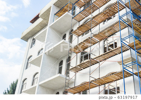 Extensive scaffolding for building a new house. 63197917