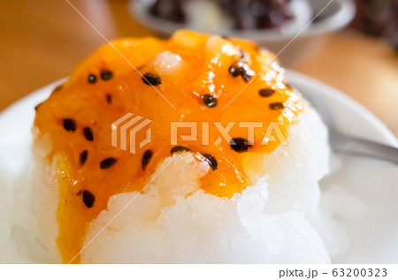 eating passion fruit shaved ice 63200323