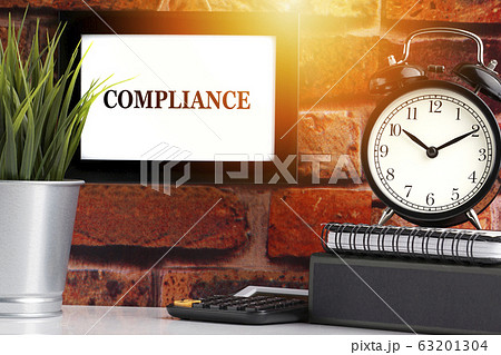COMPLIANCE text with alarm clock, books and vase 63201304