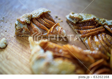 apple galette - pie on white baking parchment. Copy space, flat lay 63202168