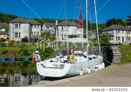Modern sailing boat docked next to Ardrishaig channel gates 63203203