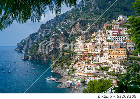 View from palm tree branches to Positano village 63203309