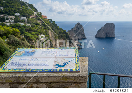Faraglioni rocks view and tourist's information. Capri island. Faraglioni rocks view and tourist's information. Capri island. 63203322