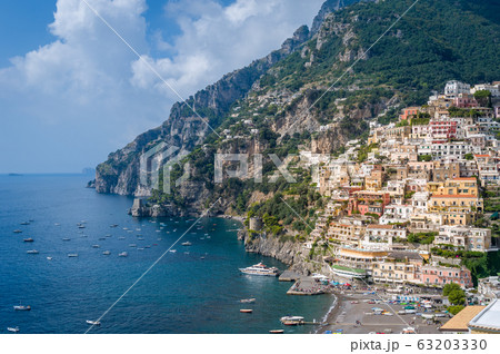 Positano town and sea bay with boats moored 63203330