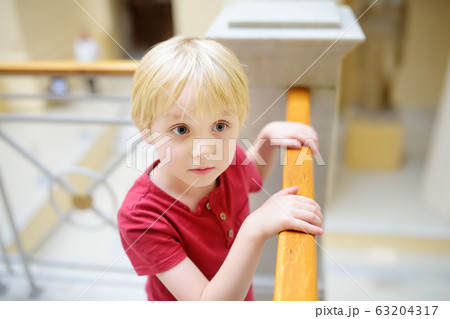 Little boy looking at sculptures during excursion Little boy looking at sculptures during excursion 63204317