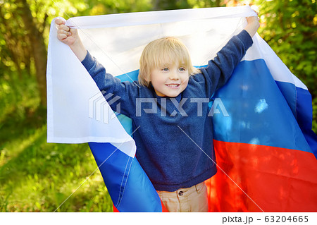 Portrait of cute little boy in public summer park 63204665