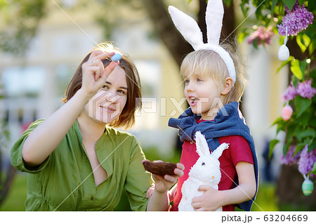 Family celebrate Easter holiday in spring park. 63204669