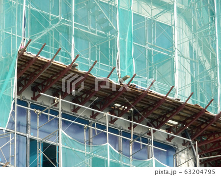 Catch platform or other construction projection from the face of a building. It is protect individuals and property from falling debris during construction.  63204795