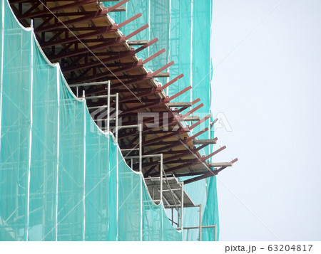 Catch platform or other construction projection from the face of a building. It is protect individuals and property from falling debris during construction. Catch platform or other construction projection from the face of a building. It is protect individuals and property from falling debris during construction. 63204817