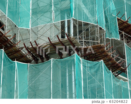 Catch platform or other construction projection from the face of a building. It is protect individuals and property from falling debris during construction. Catch platform or other construction projection from the face of a building. It is protect individuals and property from falling debris during construction. 63204822