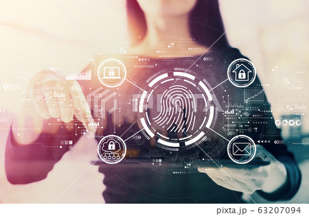 Fingerprint scanning theme with businesswoman Fingerprint scanning theme with businesswoman 63207094