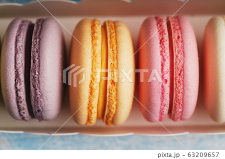 Macaroni cookies of different colors in a box on a Macaroni cookies of different colors in a box on a 63209657