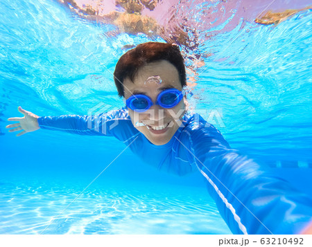 man selfie in swimming pool man selfie in swimming pool 63210492