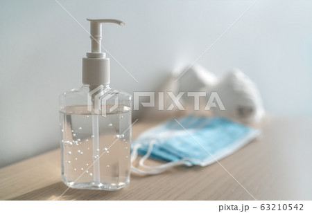Coronavirus corona virus prevention travel surgical masks and hand sanitizer gel for hand hygiene spread protection Coronavirus corona virus prevention travel surgical masks and hand sanitizer gel for hand hygiene spread protection 63210542