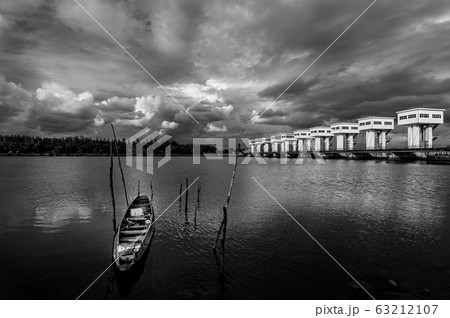 View of landscape with fishing boat and water View of landscape with fishing boat and water 63212107
