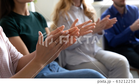 Grateful audience applauding thanking coach for presentation closeup clapping hands 63212258