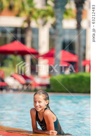 Little adorable girl in outdoor swimming pool Little adorable girl in outdoor swimming pool 63212483