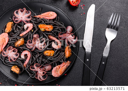 Black seafood pasta with shrimp and octopus 63213571