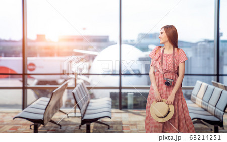 Travel tourist standing with luggage watching Travel tourist standing with luggage watching 63214251