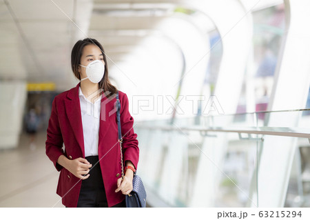 Asian girl use a protection mask for prevent PM Asian girl use a protection mask for prevent PM 63215294