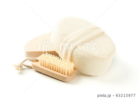 Wooden bath brush and sponges isolated on white Wooden bath brush and sponges isolated on white 63215977