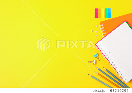 Flat lay composition with school supplies on color 63216292