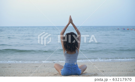 Holiday concept. Beautiful girl is practicing yoga 63217970