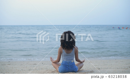 Holiday concept. Beautiful girl is practicing yoga 63218038