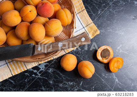 Fresh organic apricots in basket. Group of Fresh organic apricots in basket. Group of 63218283