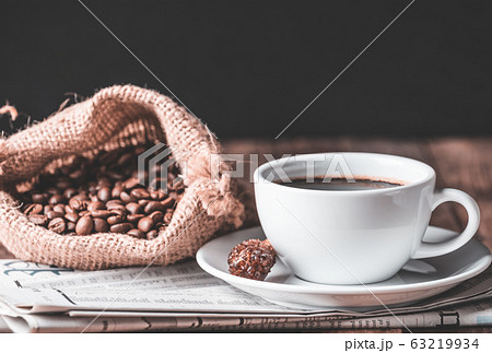Coffee cup,cinnamon stick,roasted coffee beans and 63219934