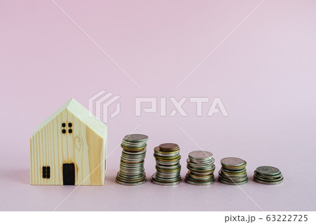 Wooden house model with step of money coins Wooden house model with step of money coins 63222725