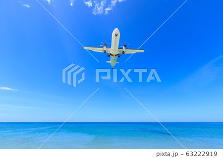 Passenger airplane landing to airport above Mai Passenger airplane landing to airport above Mai 63222919