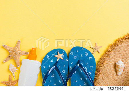 flip flops, straw hat, starfish, sunscreen bottle, 63226444